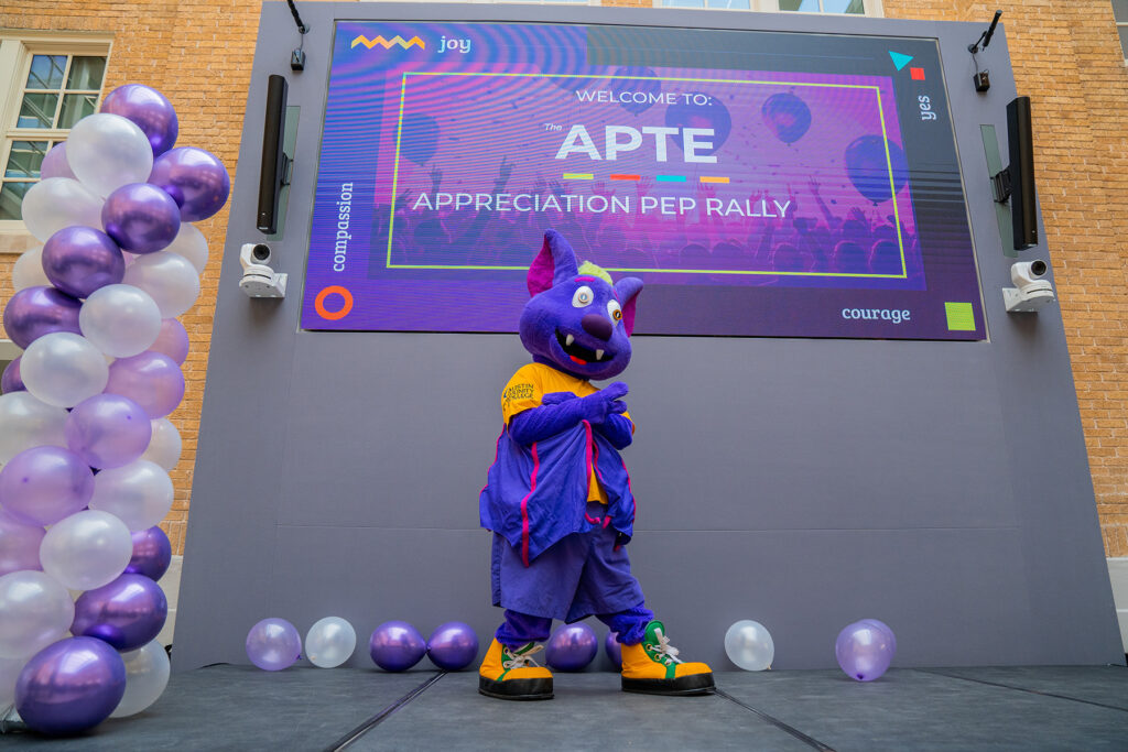 R.B. on stage at the 2025 APTE Appreciation Pep Rally.