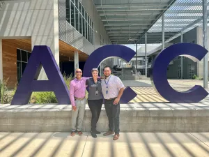 APTE Officers in front of the ACC sign at Highland campus.