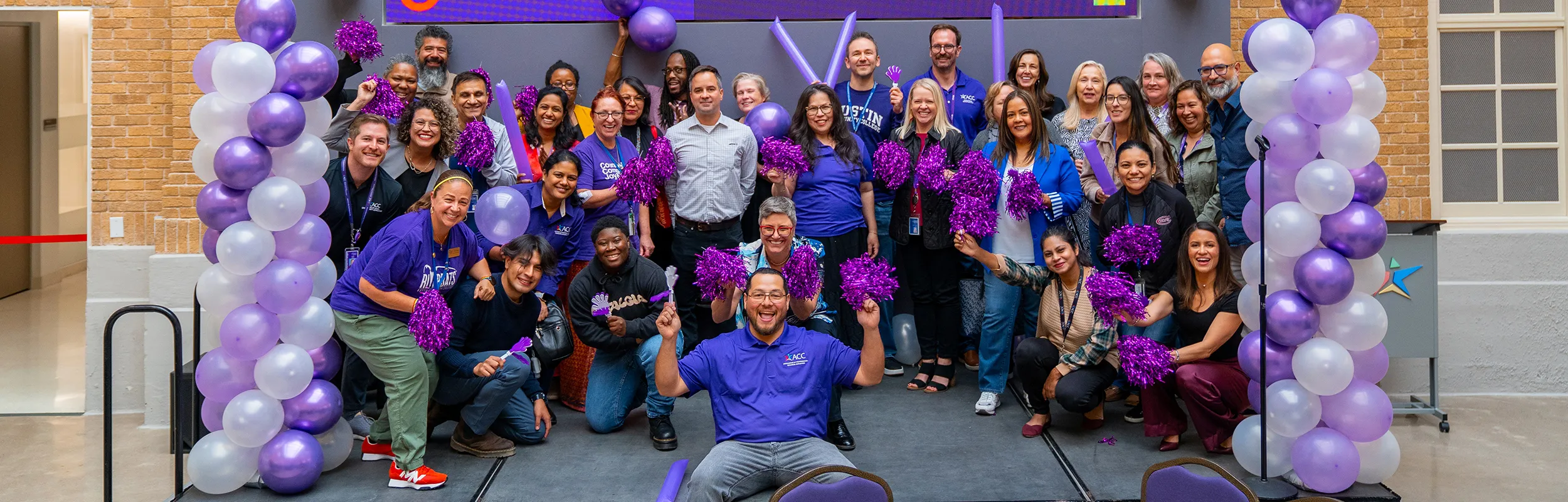 APTE members cheering at a pep rally.