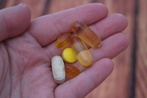 Hand holding vitamins