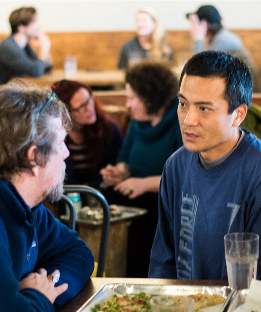 People talking at the Faculty Intellectual Feast