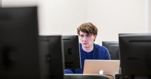 Student looking at computer in class