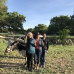 2018 GTR participants at the ranch in front of a longhorn