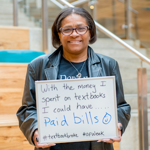 student holding a sign