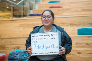 Student holding sign 