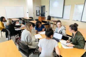 group of women working together in classroom